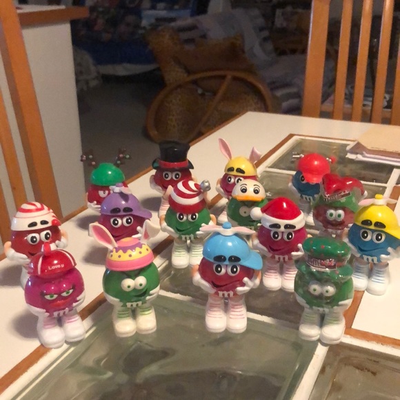 Accessories - Collectible M&M people wearing assorted hats.